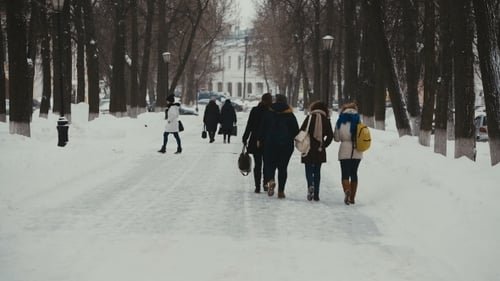 Group Of Students Going To School On a Winter Day