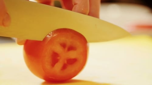 Slicing a Ripe Tomato with a Knife