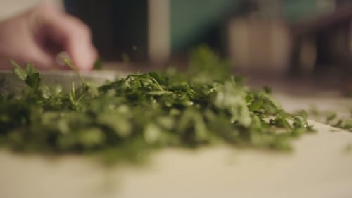 Chopping Fresh Parsley in Kitchen