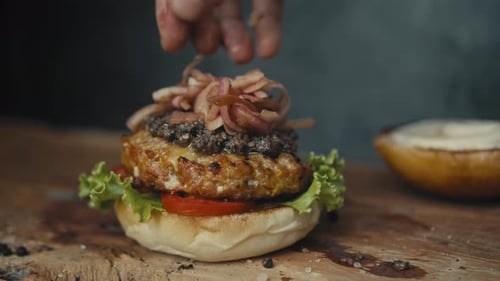 Delicious Hamburger Preparation on Wooden Board