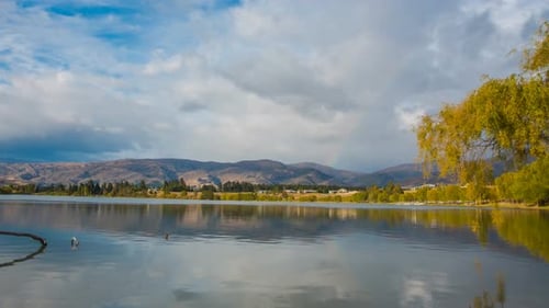 Rainbow above river timelapse
