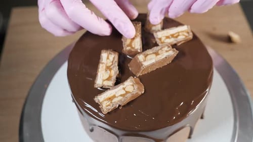 Decorating Chocolate Cake with Candy and Peanuts