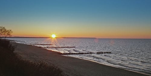 Picturesque Sunset Over Quiet Beach and Ocean