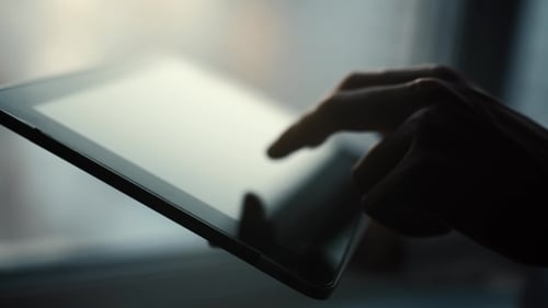 Close Up of Hand Using Tablet Touchscreen