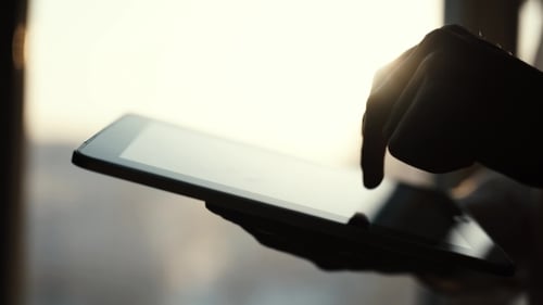Female Hands Touching Digital Tablet With Business Diagram
