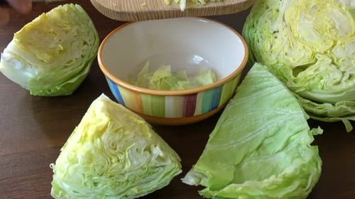 Chopping Fresh Green Lettuce for Salad