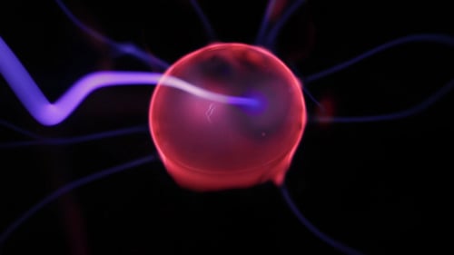 Red Plasma Ball with Electrical Discharges on Black