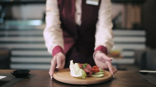 Waiter Delivers The Board With Food For Grill