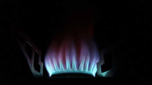 Vibrant Blue Flame Lit on Burner Close-Up