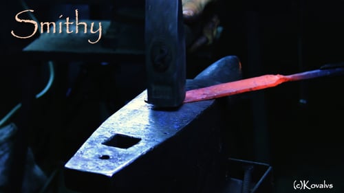 Hammering Red Hot Metal Bar on Anvil