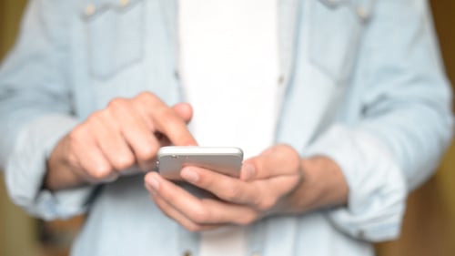 Person Using Mobile Phone with Touch Screen