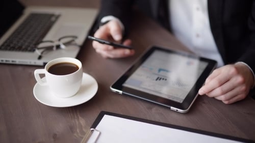 Hands with Tablet and Smartphone at Workplace
