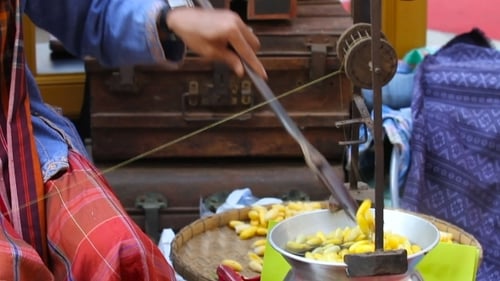 Producing Silk Thread from Silkworm Cocoons with Vintage Machine