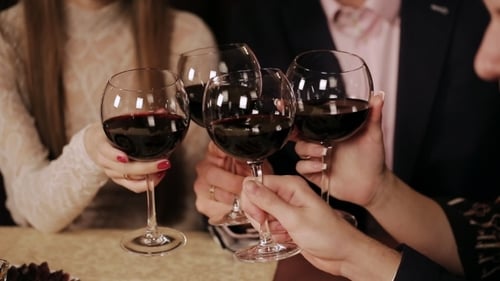 Friends At a Restaurant Drinking Wine.