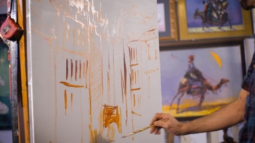 Artist Painting an Abstract Image on Canvas