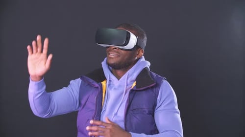 Man Enjoys Virtual Reality Experience With Headset