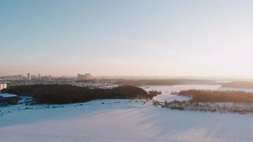 Aerial View of Frozen Lake on Sunny Winter Frosty Day