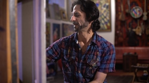 Artist Painting on a Canvas in his Studio