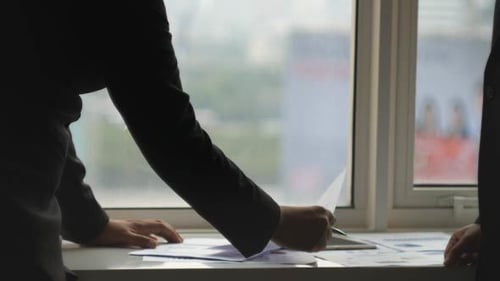 Business Teamwork at Office Window