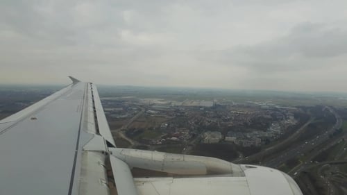 Airplane Is Flying Above The City