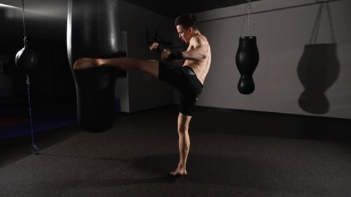 Man Training With a Punching Bag