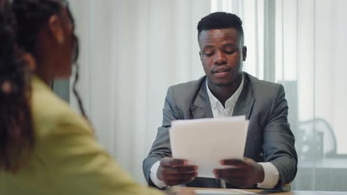 Adults Discussing Business in Office Setting