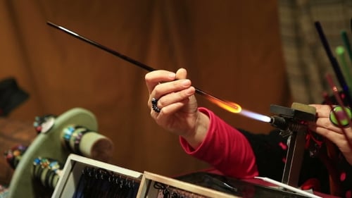Women's Hands Make Glass Beads