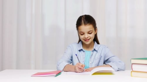 Happy School Girl With Books And Notepad At Home