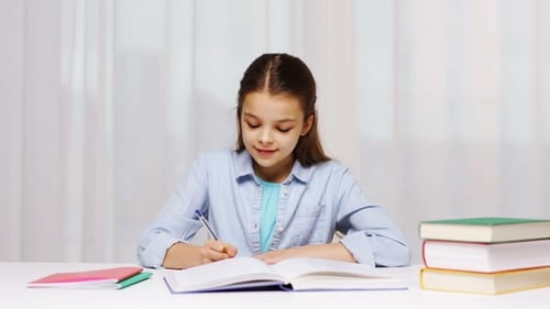 Happy School Girl With Books And Notepad At Home