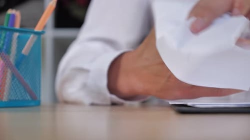 Hands Crushing Paper, Showing Frustration