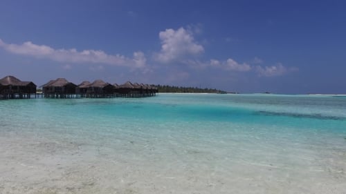 Bungalow Huts In Sea On Tropical Resort Beach 16