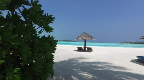 Palapa And Sunbeds By Sea On Maldives Beach 5