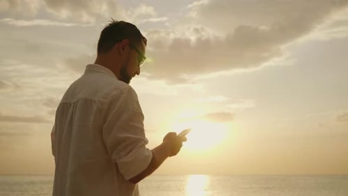 A Young Man on Vacation Near the Sea