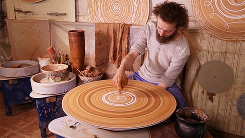 Potter Drawing a Decorative Panel