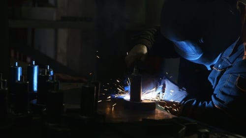Welding Operation In a Dark Room In The Manufacture