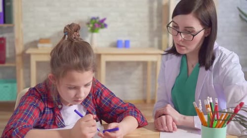 Child Is Autistic and the Doctor in a Medical Office