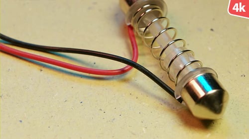 Close up of Lightbulb with Wires Attached