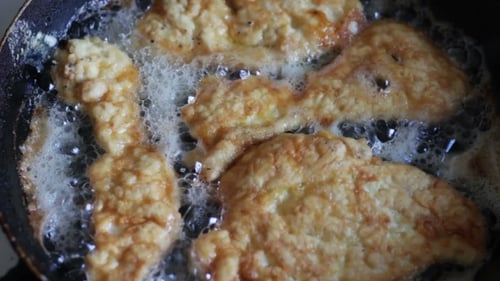 Close Up of Food Frying in Pan