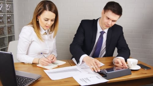Business People Having Meeting Around Table In Modern Office
