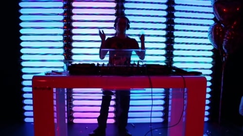 Adult DJ Performing on Stage at Party