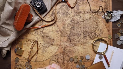 Vintage World Map with Compass, Camera and Coins