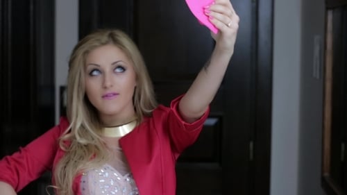 Confident Woman Poses with Blonde Hair Indoors