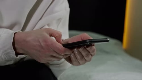 Close Up View of Woman Use of Smart Phone at Home