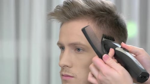 Man Getting Modern Haircut with Electric Razor