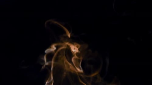 Golden-Brown Smoke Rising Slowly on Black Background