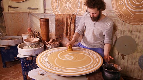 Potter Creating a Decorative Panel