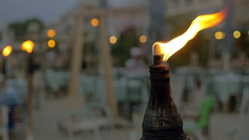 Burning Beach Torch In The Evening