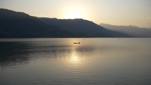 Boat In The Setting Sun