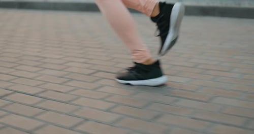 Young Woman Running In The Park