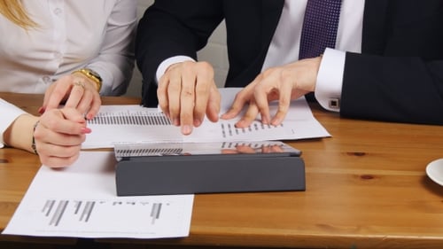 Business Team Reviewing Charts in the Workplace